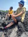 Image from H&D fieldtrip with dianaband and Hee-Ju to Jeju Island. Dir. Sungeun Kim (Grace) sharing about the history of the Island on a peace of the remaining rock formation.